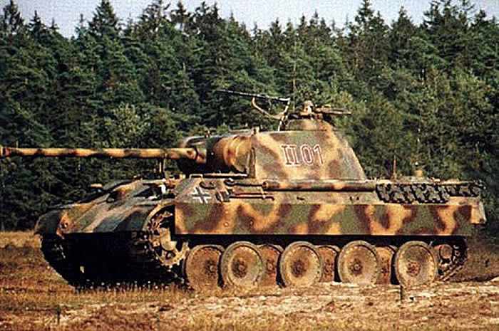 [Photo 7 - A Pz Kpfw V 'Panther' Ausf A with a tri-colour camouflage pattern, carefully applied by the vehicle maintenance crew. Note that you can see the interior color for the vehicle on the opened driver's hatch.]