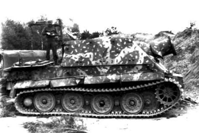 [Photo 8e - Sturmtiger in a field applied Hinterhalt-Tarnung. This is a Sturmtiger that was captured in 1945.]