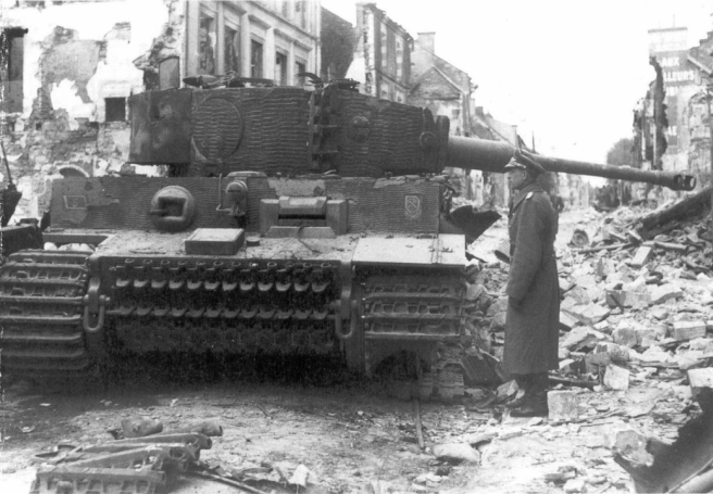 Tiger crippled during fighting in and around Villers Bocage from the 101st Schwere SS Panzer Abteilung (Micheal Wittman's unit in Normandy). Note the tactical markings on the right and left front of the vehicle and on the turret.
